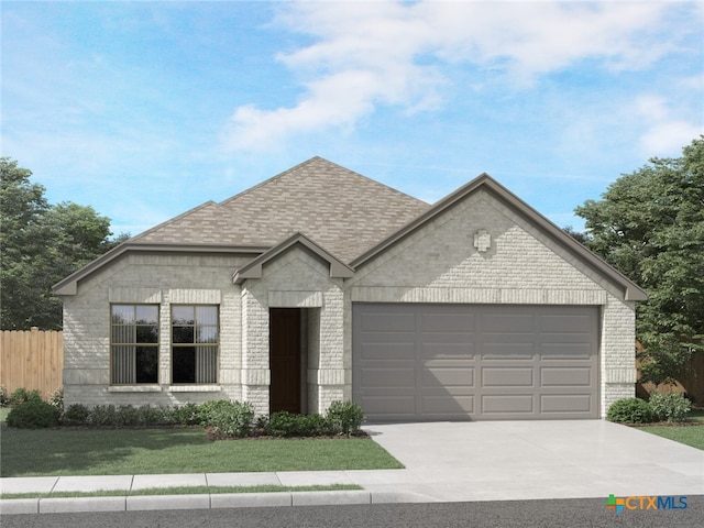 view of front of home with a garage and a front yard