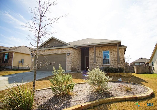 single story home featuring concrete driveway, fence, brick siding, and a garage