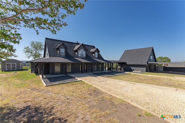 view of front facade featuring a carport and a front lawn