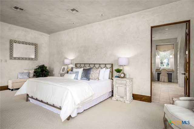 bedroom featuring carpet floors, visible vents, and baseboards