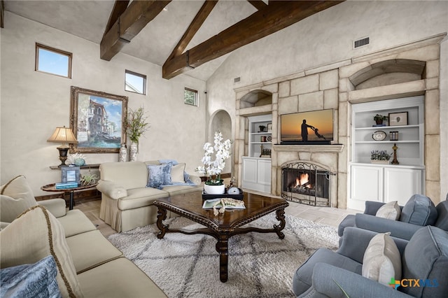 living room with high vaulted ceiling, built in shelves, a premium fireplace, visible vents, and beam ceiling