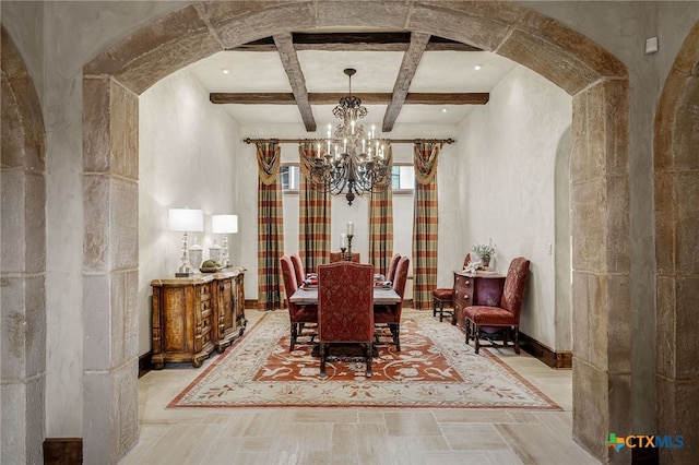 dining space with arched walkways, coffered ceiling, baseboards, beamed ceiling, and an inviting chandelier