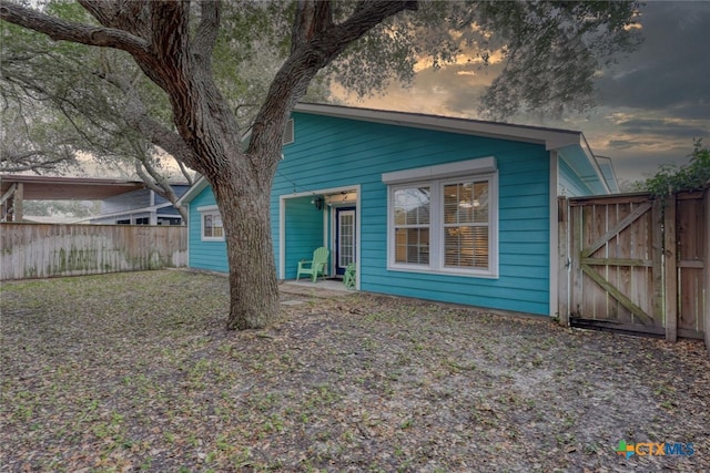 126 Breezy St, Rockport, TX 78382 - view of front of house with a gate