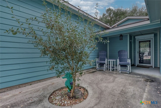 property entrance with a patio area