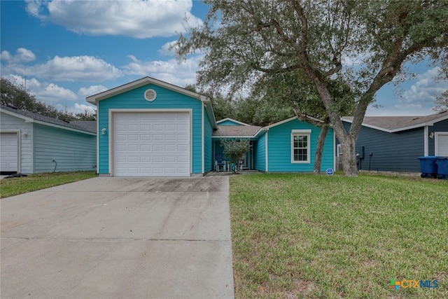 single story home featuring a garage and a front lawn