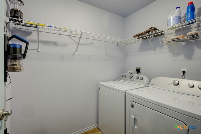 126 Breezy St, Rockport, TX 78382 - laundry area with washer and clothes dryer and baseboards