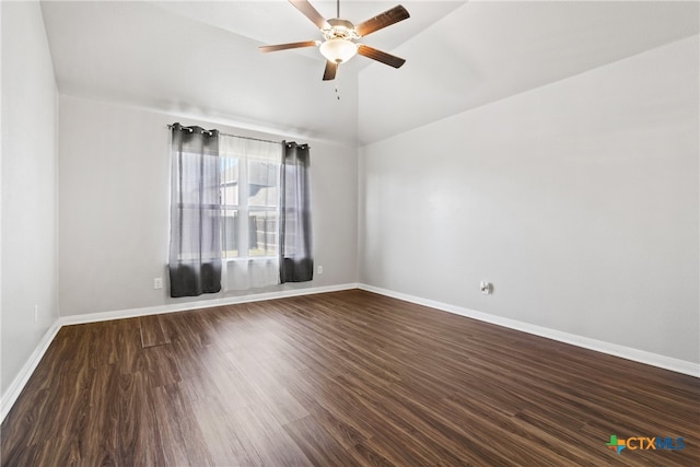 empty room with hardwood / wood-style floors, ceiling fan, and vaulted ceiling