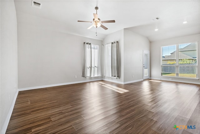 unfurnished room with dark hardwood / wood-style floors, ceiling fan, and vaulted ceiling