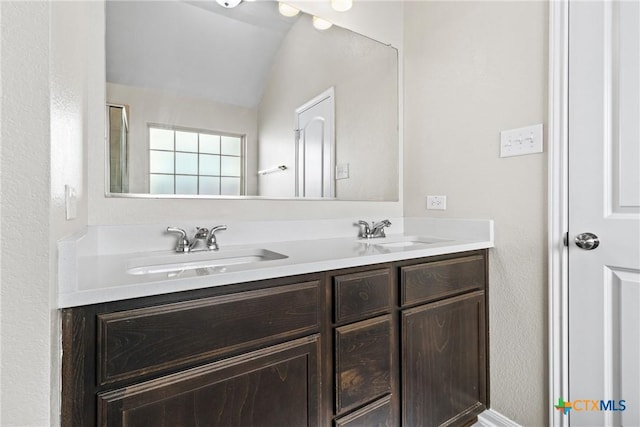 1910 Ashburn Dr, Temple, TX 76502 - full bathroom featuring double vanity and lofted ceiling