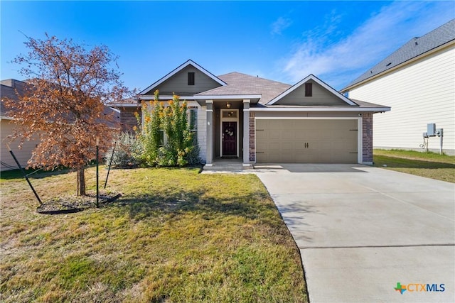 1910 Ashburn Dr, Temple, TX 76502 - single story home with an attached garage, driveway, a front yard, and brick siding