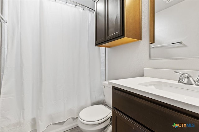 1910 Ashburn Dr, Temple, TX 76502 - bathroom featuring vanity, toilet, and shower / tub combo with curtain