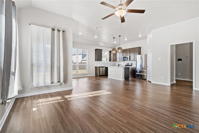 unfurnished living room with dark hardwood / wood-style floors, ceiling fan, and lofted ceiling