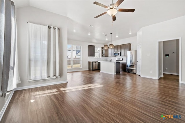 1910 Ashburn Dr, Temple, TX 76502 - unfurnished living room featuring ceiling fan, lofted ceiling, dark wood-style flooring, baseboards, and recessed lighting