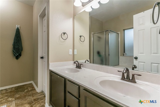 6707 Bayberry Dr, Killeen, TX 76542 - full bathroom with a stall shower, double vanity, and baseboards