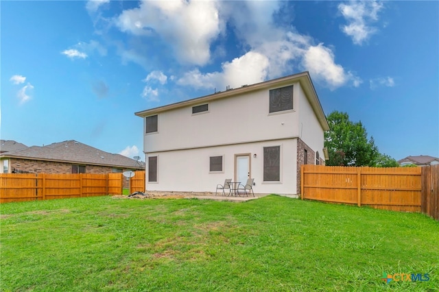 6707 Bayberry Dr, Killeen, TX 76542 - back of house with stucco siding and a patio area