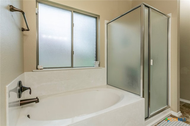 6707 Bayberry Dr, Killeen, TX 76542 - full bathroom featuring healthy amount of natural light, a shower stall, and a bath