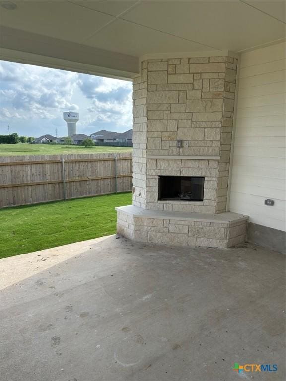7217 Touchstone Dr, Temple, TX 76502 - view of patio / terrace with an outdoor stone fireplace