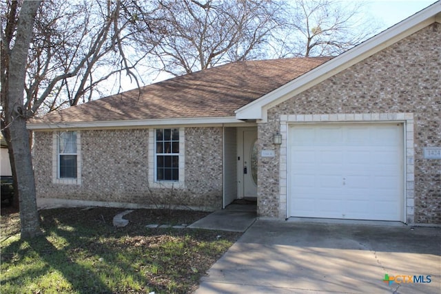 single story home with a garage