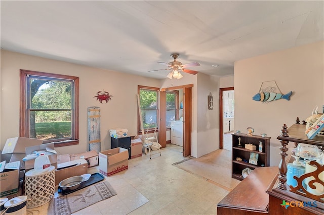 misc room with washer / clothes dryer and ceiling fan