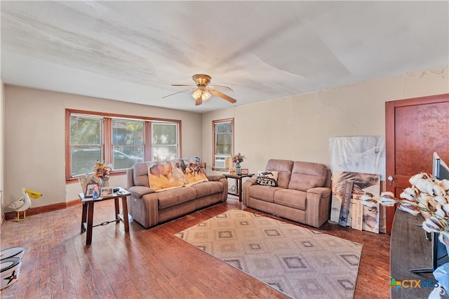 living room featuring wood-type flooring and ceiling fan