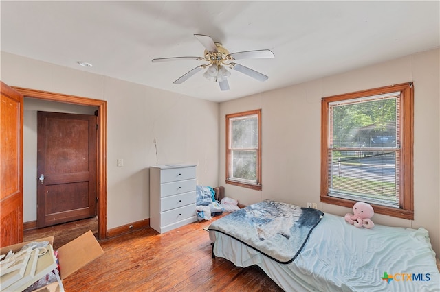 bedroom featuring ceiling fan and light hardwood / wood-style flooring