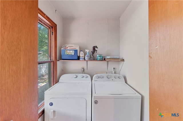 laundry area with separate washer and dryer