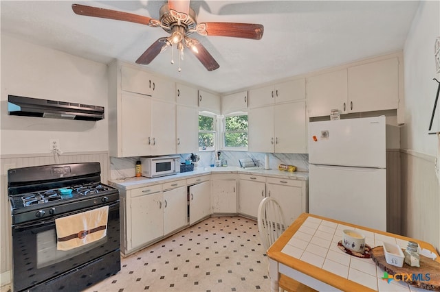 kitchen with white cabinetry, ceiling fan, white appliances, and ventilation hood