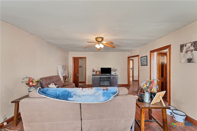 living room featuring hardwood / wood-style flooring and ceiling fan