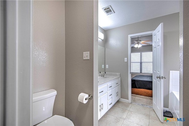 ensuite bathroom featuring visible vents, toilet, tile patterned floors, ensuite bathroom, and vanity