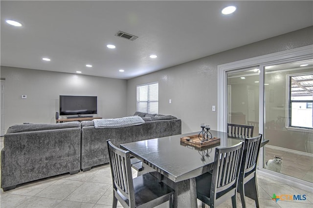 dining room with a wealth of natural light, visible vents, and recessed lighting