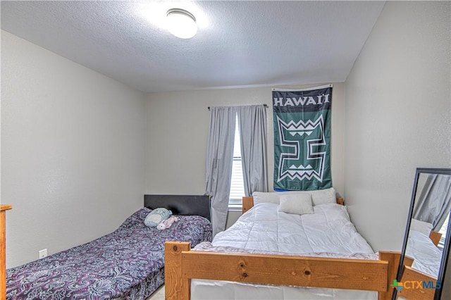 bedroom featuring a textured ceiling