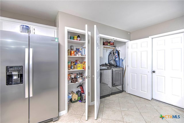 pantry featuring washer and clothes dryer