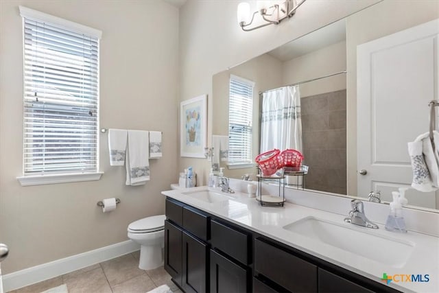 702 Old Settlers Dr, San Marcos, TX 78666 - full bath with tile patterned floors, a sink, toilet, and baseboards