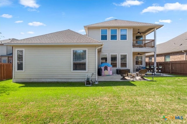 702 Old Settlers Dr, San Marcos, TX 78666 - rear view of property with a fenced backyard, a balcony, a yard, and ceiling fan