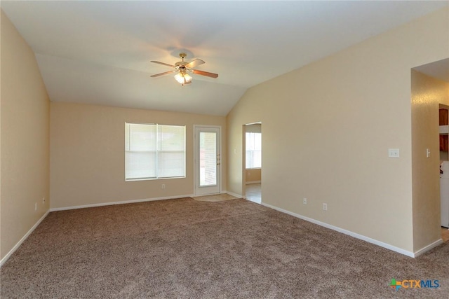 spare room with carpet floors, ceiling fan, and lofted ceiling