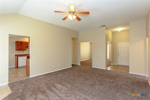 carpeted empty room with ceiling fan and lofted ceiling