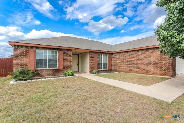 ranch-style house with a front lawn