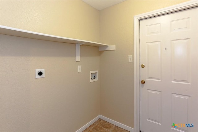 laundry area with hookup for a washing machine, light tile patterned flooring, and hookup for an electric dryer