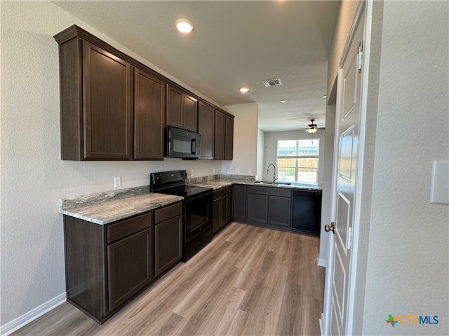 kitchen with black appliances, ceiling fan, dark brown cabinets, and light hardwood / wood-style floors