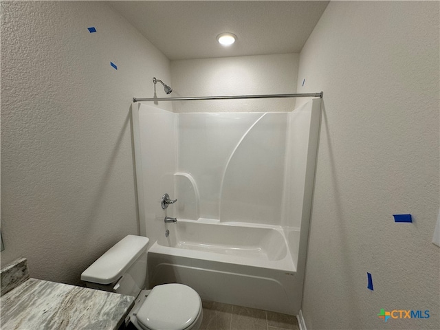 bathroom with toilet, a textured ceiling, and  shower combination