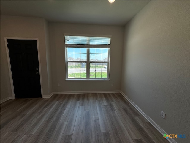 spare room featuring hardwood / wood-style flooring