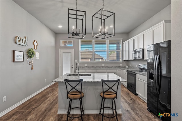 kitchen featuring white cabinetry, a center island, sink, dark hardwood / wood-style flooring, and black appliances