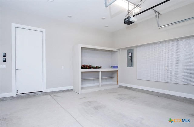 garage featuring a garage door opener and electric panel