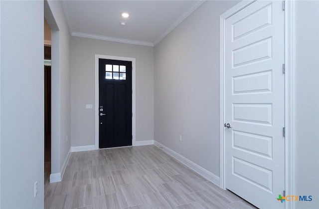 entryway featuring ornamental molding