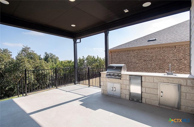 view of patio / terrace with area for grilling, grilling area, and sink