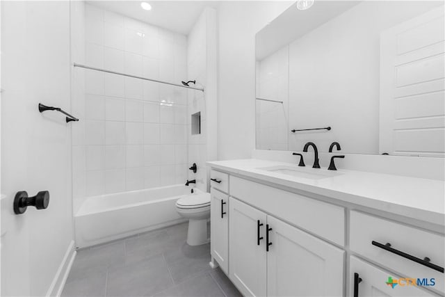 full bath with toilet, tile patterned flooring, bathtub / shower combination, and vanity