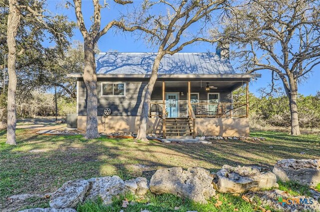 1001 Alpine Trl, San Marcos, TX 78666 - view of front facade with central air condition unit, a front yard, covered porch, and ceiling fan