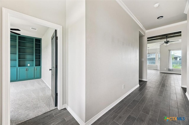 606 Juniper Dr, Troy, TX 76579 - hall featuring dark wood-type flooring, crown molding, and built in features