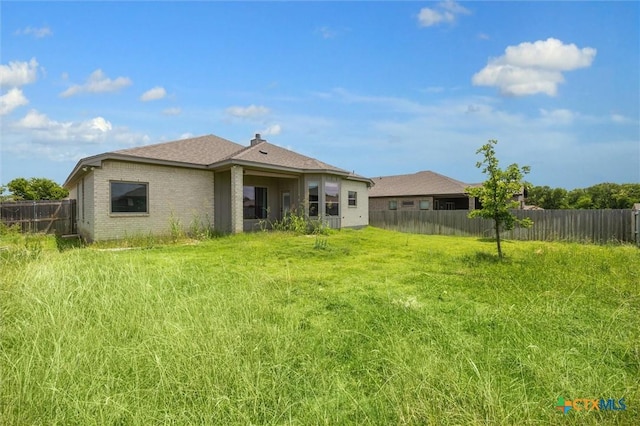 606 Juniper Dr, Troy, TX 76579 - rear view of house featuring brick siding