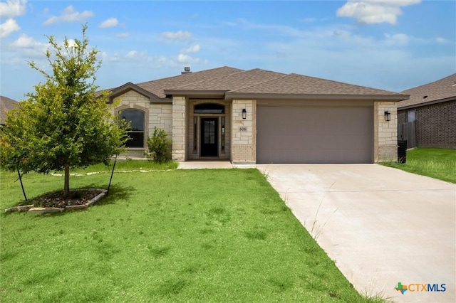 606 Juniper Dr, Troy, TX 76579 - view of front facade with a front lawn, a garage, concrete driveway, stone siding, and brick siding